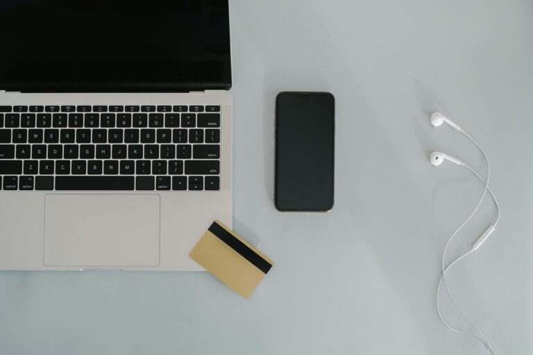 high angle shot of a laptop and smartphone on the table